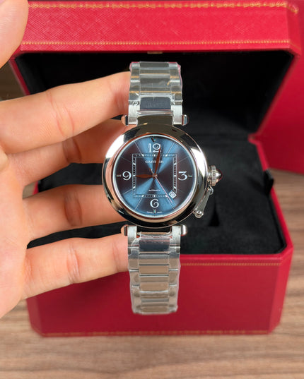 CARTIER PASHA PLATEADO FONDO AZUL