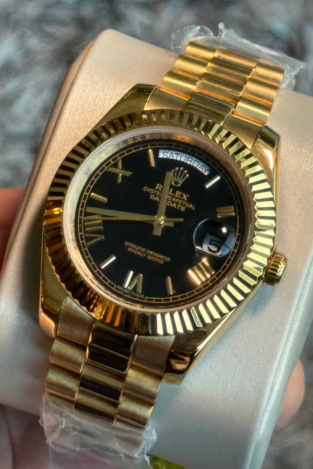 ROLEX DAY DATE II 41mm - BLACK ROMAN DIAL & BEZEM, YELLOW GOLD PRESIDENT BRAZALET