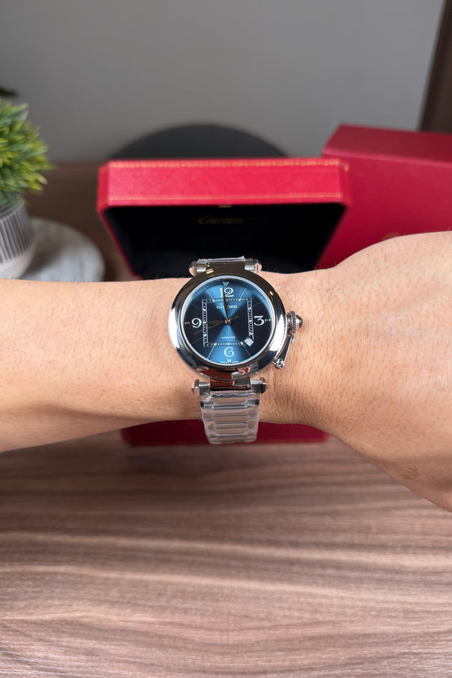 CARTIER PASHA PLATEADO FONDO AZUL