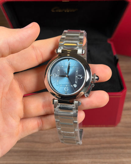 CARTIER PASHA PLATEADO FONDO AZUL