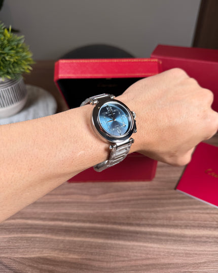 CARTIER PASHA PLATEADO FONDO AZUL